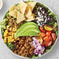 Super Taco Salad · Plant based protein sauteed with onions on a bed of spring mix, avocado, red onions, roasted...