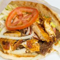 Chicken Shawarma Wrap · Chicken shawarma, lettuce, onions, tomatoes, tzatziki, pita bread.
