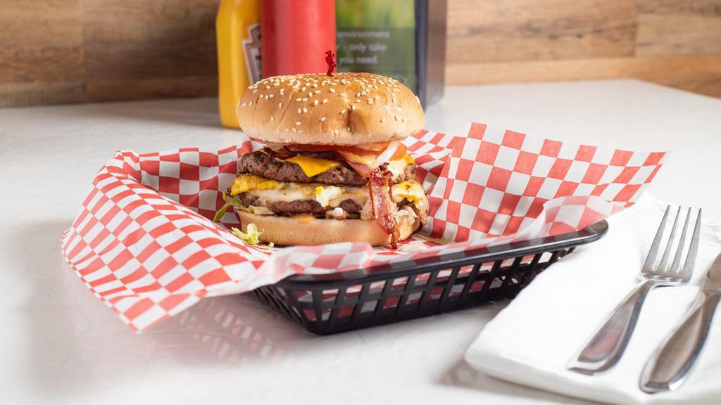 Badmash (Gangster) Burger · Lettuce, Thousand Island, two patty, American, Swiss, bacon, egg, mayo, pickles, onion, tomato sauce.
