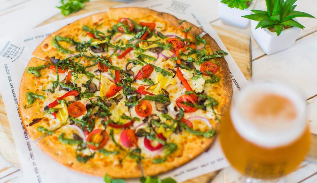The Chronicle · Extra virgin olive oil, mozzarella, imported artichoke hearts, grape tomato, red onion, crimini mushroom, chevre, roasted red bell peppers, finished with fresh basil and basil pesto.