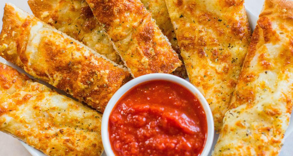 Garlic Cheesy Bread · Extra virgin olive oil, fresh minced garlic, mozzarella, aged Parmesan, Italian herbs, with a side of red sauce.