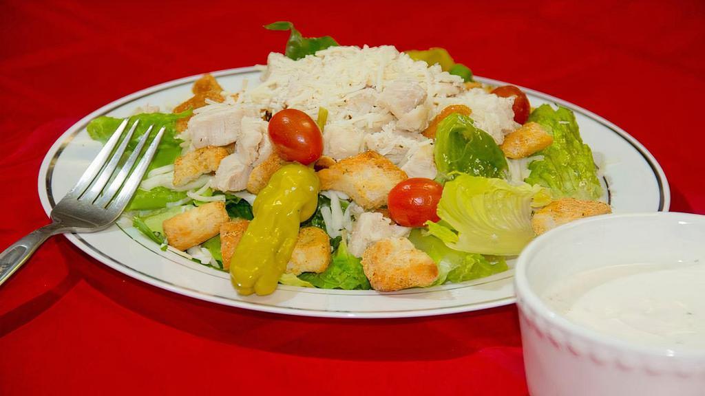 Chicken Caesar Salad · Lettuce, chicken breast, Caesar dressing, croutons, and Parmesan cheese.