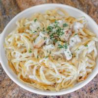 Linguine Chicken Alfredo · Pasta with cream sauce, a touch of Parmesan, and savory spices. Includes our deliciously ten...
