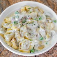 Tortellini Mona Lisa · Our meat tortellini is prepared with our chef's Romano cream sauce with sweet peas and Itali...