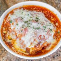 Lasagna Della Casa · Layered pasta with meat and Italian cheese, baked in red sauce, topped whole milk mozzarella...