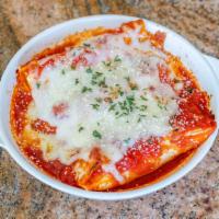 Manicotti Florentine · Fresh tube pasta stuffed with spinach and blended cheeses. Baked with marinara sauce.