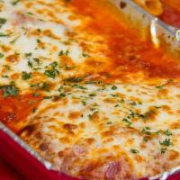 Chicken Parmigiana · Homestyle breaded chicken baked with marinara sauce and topped with melted whole milk mozzar...