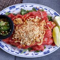 Beef Carpaccio · Bo tai chanh. Raw beef served with peanuts.