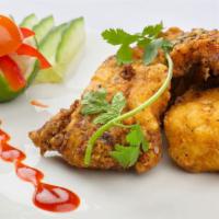 Fish Pakora · Fish deep-fried and served with tamarind and mint sauce.