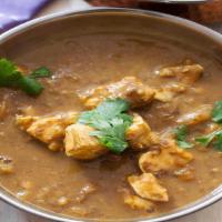 Chicken Daal · Chicken cooked in traditional yellow lentils flavored with crispy fried garlic and onion tem...