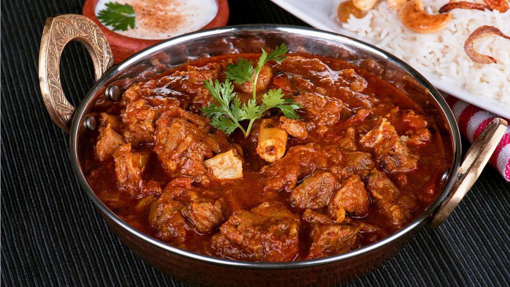 Goat Curry · Goat cooked in a traditional blend of curry spices.