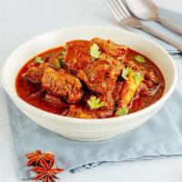 Lamb Vindaloo · Lamb cooked with potatoes and special spicy sauce.