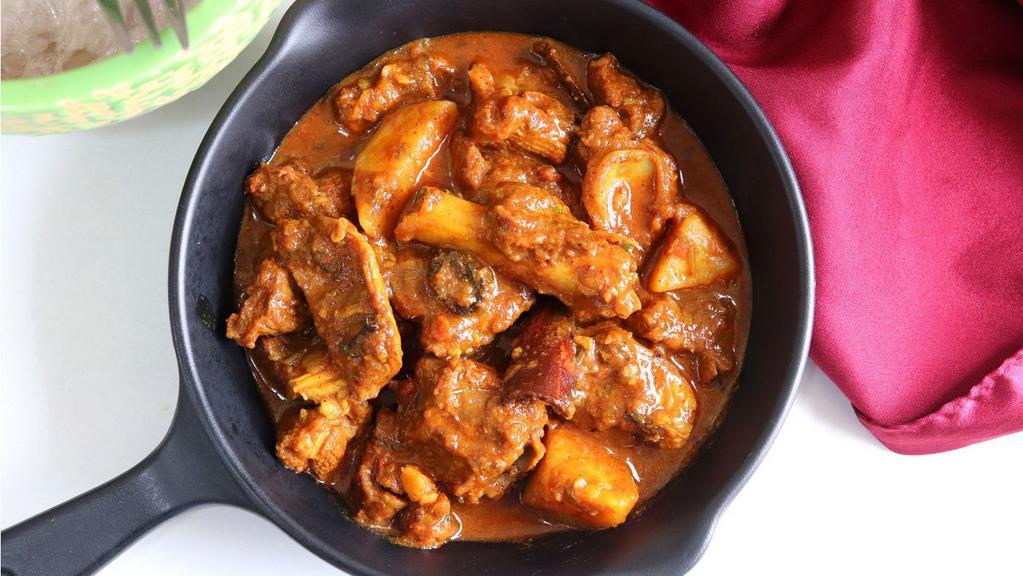 Goat Vindaloo · Goat cooked with potatoes and special spicy sauce.