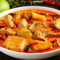 Fish Curry · Tender fish cooked in coconut gravy with fresh tomatoes, ginger, garlic, herbs and spices.