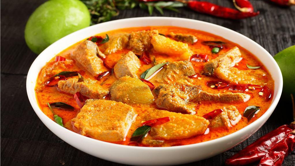 Fish Curry · Tender fish cooked in coconut gravy with fresh tomatoes, ginger, garlic, herbs and spices.