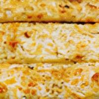 Greek Bread · Pizza bread with creamy garlic sauce, dusted with feta cheese and via mia seasoning.