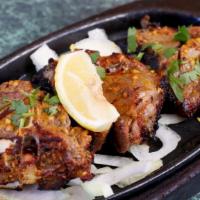 Tandoori Lamb Chops · Tandoori Seasoned Lamb Chops Meat Skewered and Grilled in Clay Oven, Served On Hot Sizzling ...