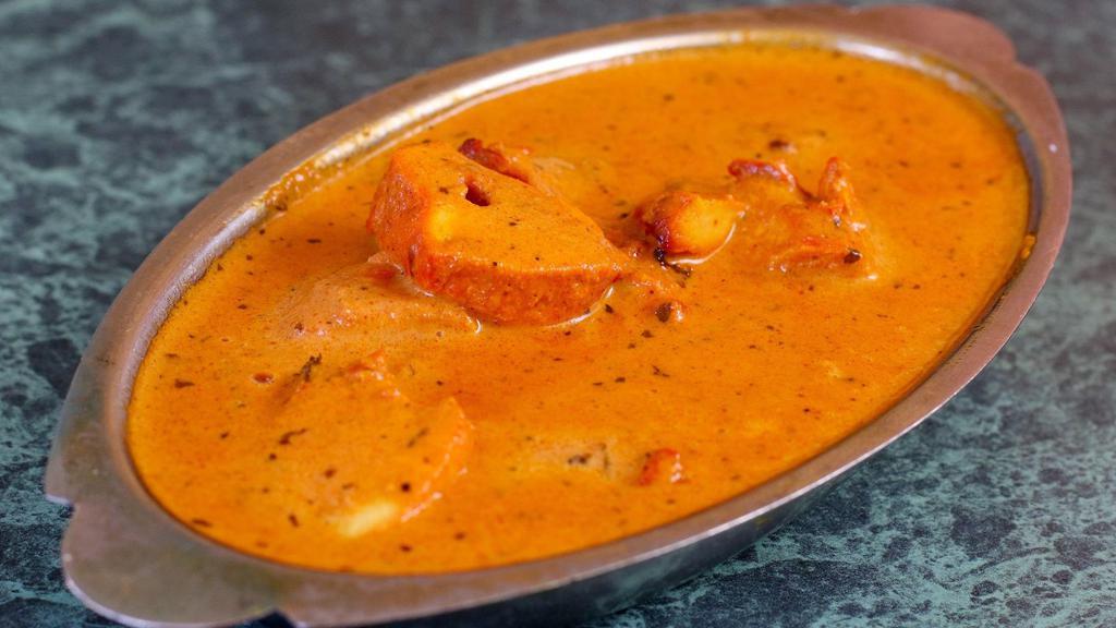 Chicken Tikka Masala · Tandoori Grilled Chicken Breast Cooked in Butter Cream Sauce
.and seasoned with spices/