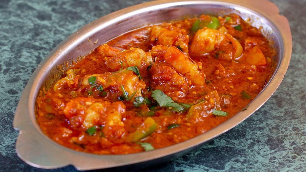 Fish Masala · Fish cooked with curry sauce and spices.