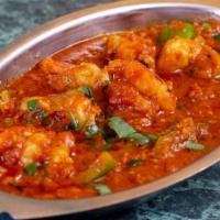Prawn Masala · Giant prawns cooked with herbs and spices.