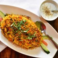 Vegetable Biryani · Assorted Vegetables Cooked in Rich Curry Sauce, Layered with Basmati Rice and Spices. Served...