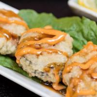 Fire Cracker · tempura-style salmon sushi roll.