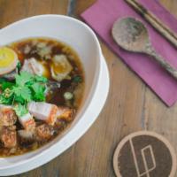 Kuay Jub · Rolls rice noodles with pork entrails, crispy pork belly and boiled eggs in Thai herb soup.