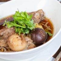 Kuay Tiew Moo Toon · Braised pork spareribs in black mushroom soup.