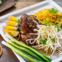 Ba Mee Kha Moo · Braised pork legs served with egg noodles, egg, beansprout, Chinese broccoli and chili vineg...