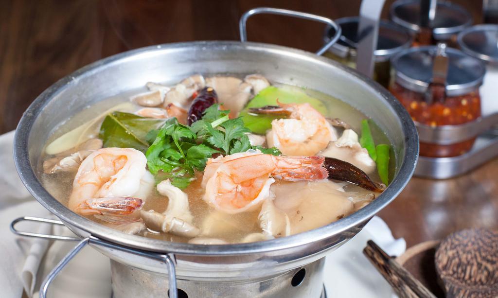 Tom Yum · Traditional spicy and sour soup with lemongrass, mushrooms and kaffir lime leaves.