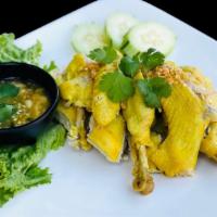 Gai Tom Nam Pha · Steamed yellow chicken (bone-in) in fish sauce served with garlic black bean sauce.