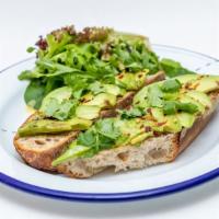 Avocado Toast · Toasted sliced country levain topped with olive oil, avocado, cilantro, salt and pepper. Eve...