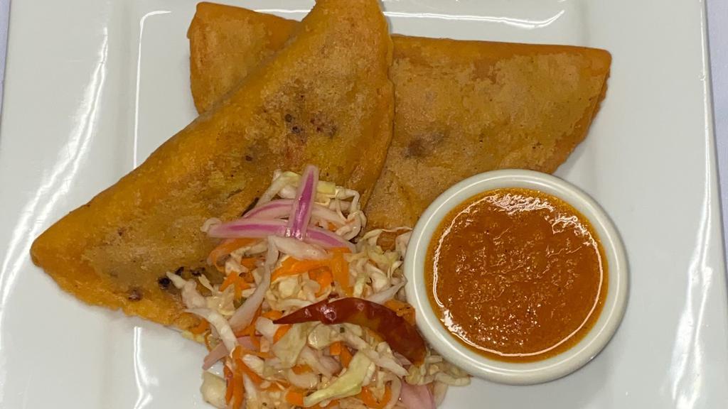  - Pasteles Beef · 2 crispy pastels filled with cooked ground beef, potatoes, carrots, onions, tomato. Served with pickled cabbage, fresh tomato sauce.