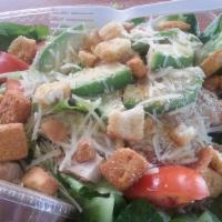 Chicken Caesar Salad · Grilled chicken, Roman lettuce, parmesan cheese and croutons served with Caesar dressing.