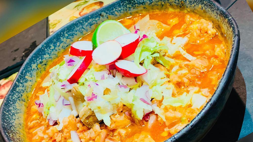 Pozole Rojo · Pork, hominy, garnished with iceberg lettuce, red onions, lime, radishes and housemade spicy chile de arbol.