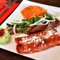 Tampinqueña · Grilled ribeye steak topped with roasted poblano peppers & sautéed onions with mexican rice ...