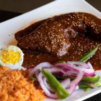 Mole Negro Oaxaqueño · BRAISED CHICKEN THIGH & LEG WITH RICE GARNISHED WITH
PICKLED ONIONS & SERRANO PEPPER