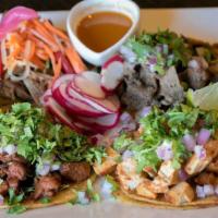 Capullo's Taco Plate · 4 tacos, corn tortillas, grilled steak, grilled chicken, carnitas & al pastor served with ci...