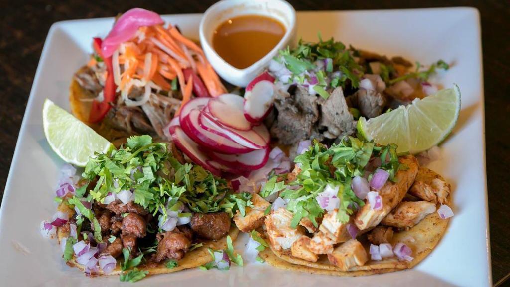 Capullo's Taco Plate · 4 tacos, corn tortillas, grilled steak, grilled chicken, carnitas & al pastor served with cilantro, onions & salsa