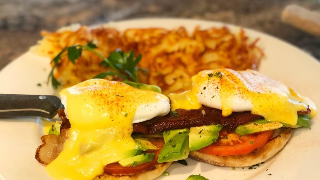 California · English muffin, strips of bacon, avocado, tomatoes, two poached eggs, and hollandaise sauce.