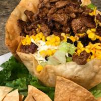 Taco Salad · Steak or chicken, mixed greens, avocado, tomato, cheddar and jack cheese, black beans, corn,...