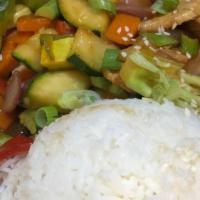 Stir-Fry Chicken · Broccoli, mushrooms, green peas, zucchini, carrot, bell pepper, onions, and white rice.