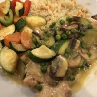 Chicken Bellini · Chicken, peas, zucchini, mushrooms in a lemon-butter sauce with choice of mashed potato or r...