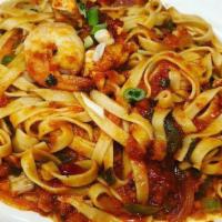 Fettuccine Jambalaya · Prawns, chicken and andouille sausage in creole sauce.