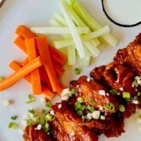 Buffalo Style Chicken Wings · Celery, Carrots, Blue Cheese