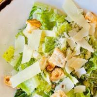 Caesar Salad · Romaine lettuce, garlic croutons, parmesan, roasted garlic dressing.
