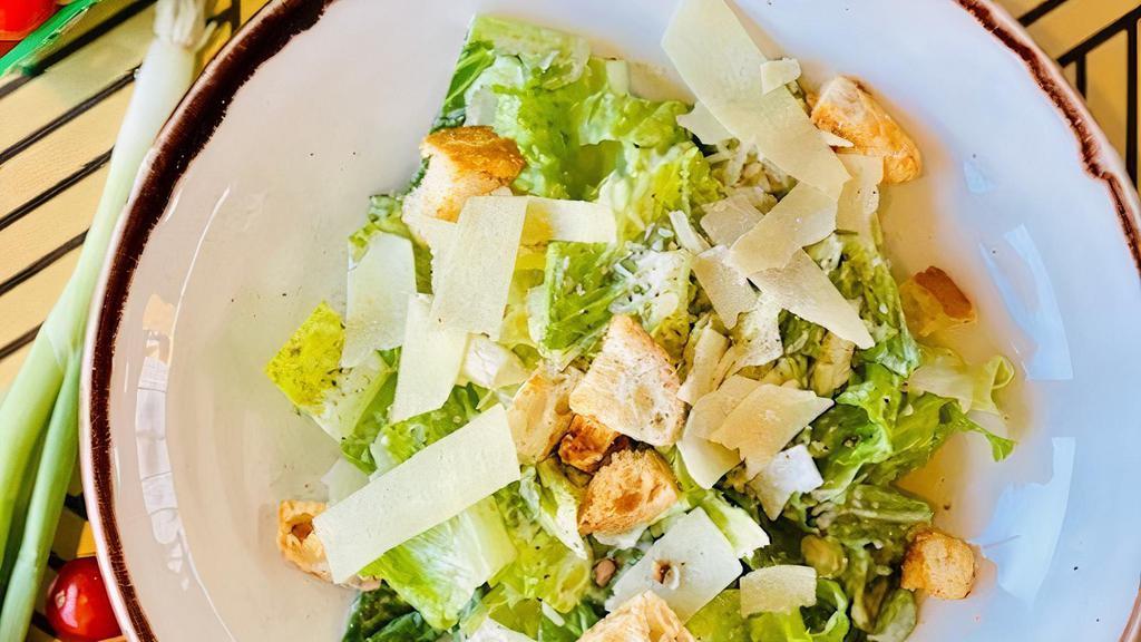 Caesar Salad · Romaine lettuce, garlic croutons, parmesan, roasted garlic dressing.