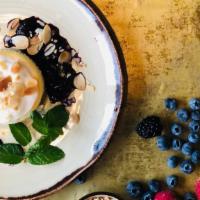 Toasted Almond Cheesecake · Blueberry Compote