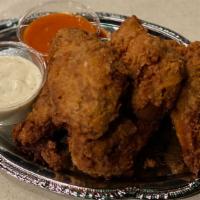Martha's Crispy Fried Chicken Wings · Organic, buttermilk battered wings, crystal hot sauce, house ranch on the side. Six pieces.