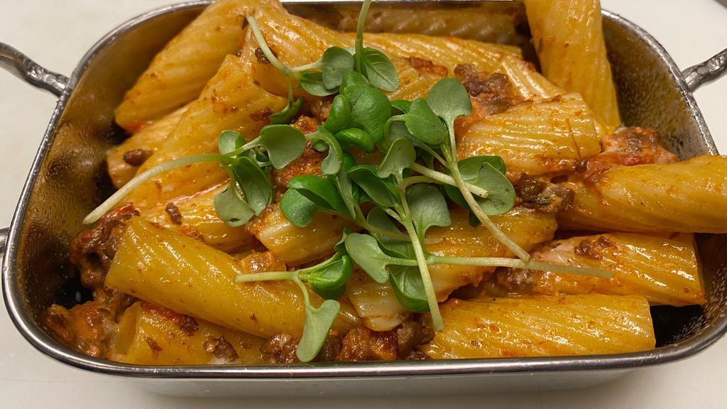 Beyond Bolognese · Vegetarian. Rigatoni, Tomato Bolognese Sauce with plant-based, ground Beyond meat, Onions, Garlic and Fresh Herbs.